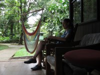 I relax in the rocking chair and read a book.